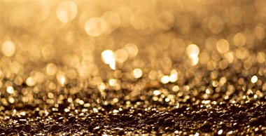 Işıl ışıl ışık bulanıklığı. Altın parıltı parçacıkları arkaplanı.