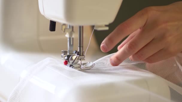 The process of hemming curtain edges from white mesh fabric. — Stock Video