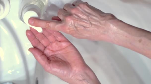 Concept of protecting the body from germs and viruses. Hand of woman that applying lather and soap — Stock Video