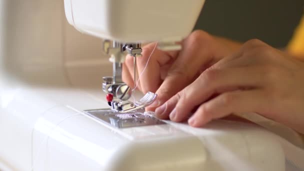 The process of hemming the edges of the curtains. The needle drops. The sewing process begins. Close up view. — Stock Video