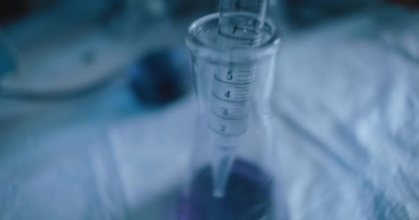 Tracking Close Shot Purple Liquid Being Taken Out Conical Flask — Stock Video