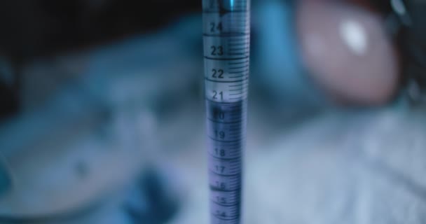 Tracking Close Shot Purple Liquid Being Put Conical Flask Close — 비디오