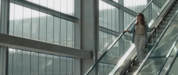 Woman Long Hair Denim Shirt Sunglasses Going Escalator Holding Her — Stock Video