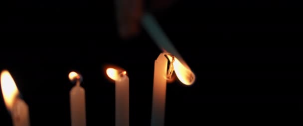 Person Lighting Hanukkah Menorah Candles Dark Room Slow Motion Bmpcc — Stock Video