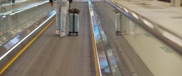 Man Walking Escalator Walkway Airport Terminal Suitcase Slow Motion Bmpcc — Stock Video