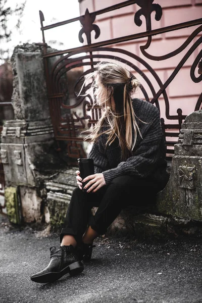 Pretty young woman in stylish sweater holding cup in hands. Warm soft cozy image. Details. Drinking take away coffee.. Instagram style — Stock Photo, Image