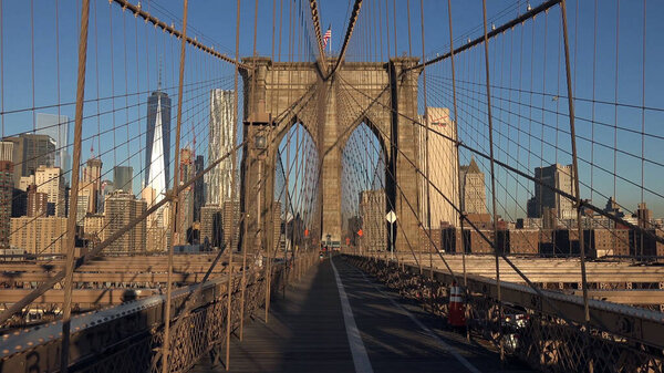 Brooklyn bridge and manhattan high buildings, walking path way, empty road, New York, USA