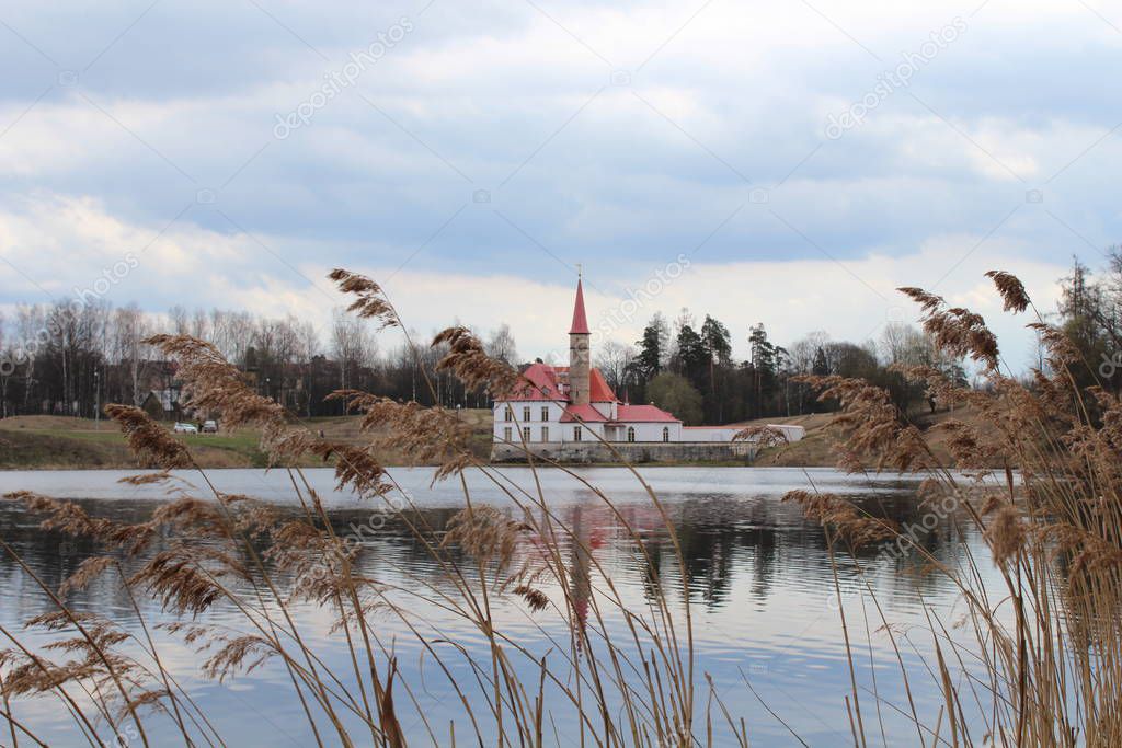 The Priory castle and the Black Lake view in april. Gatchina, Leningrad Oblast, Russia.