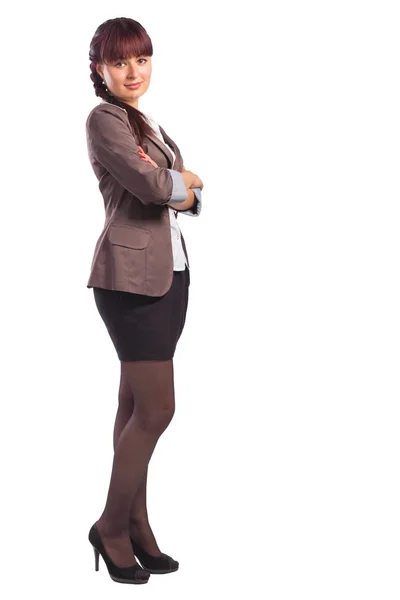 Full length of young business woman standing with arms folded — Stock Photo, Image