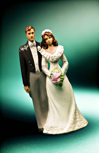 Small decorative wedding cake dolls