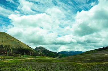 white cloudy among mountains