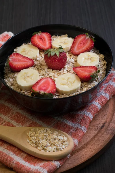 Bowl with strawberry and banana oatmeal — Stock Photo, Image