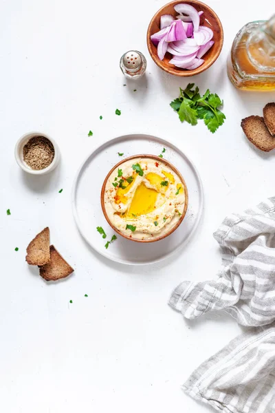 stock image Chickpeas hummus with toasted bread, olive oil and paprika on a white background