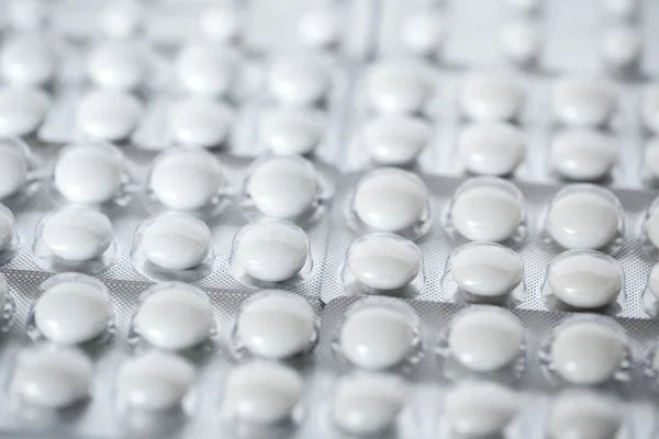 Sammenhengende hvite tabletter . – stockfoto