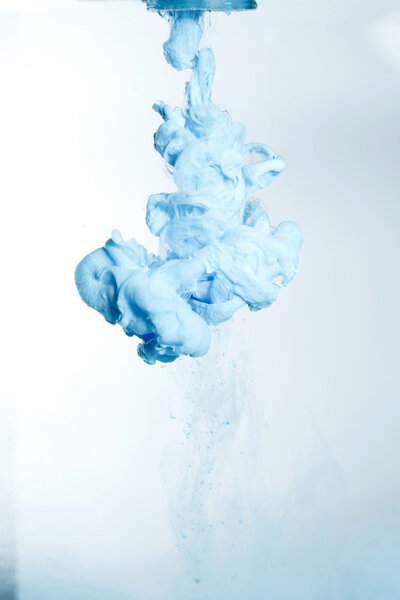 Liquid Blue ink cloud in water. 
