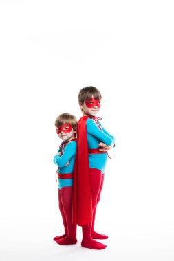 Two boy superhero with a mask and cloak full length look at camera. clipart