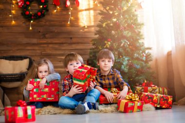 Group children with Christmas presents. Dreamers. clipart