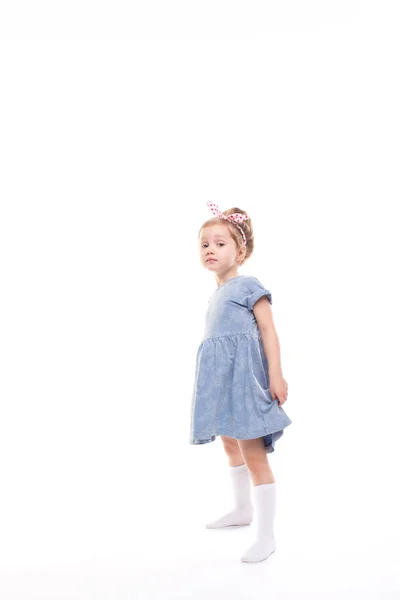 Little girl full length posing on a white. — Stock Photo, Image