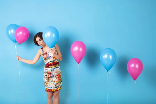 Funny Woman with helium balloons.