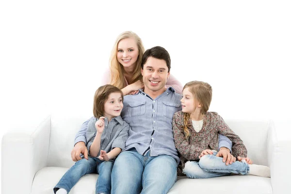 Happy family sitting together. — Stock Photo, Image
