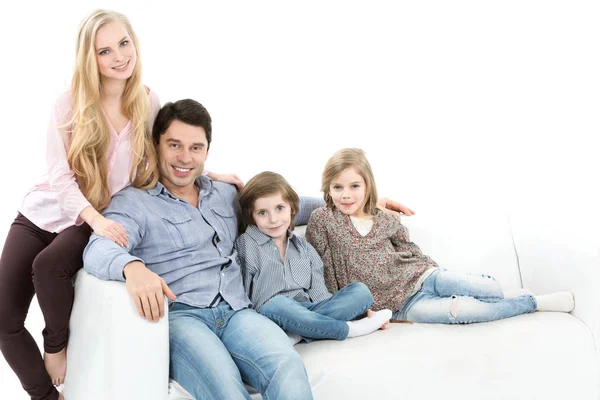 Happy family on the couch isolated.