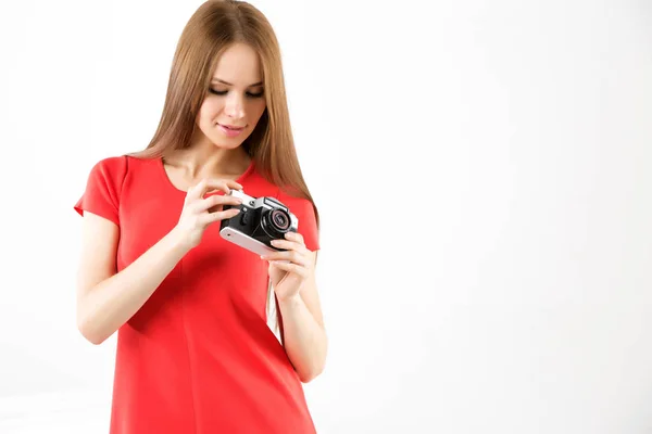 Young beautiful woman with an old camera. — Stock Photo, Image