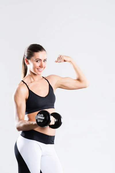 Woman workout with dumbbells, isolated in a white background. — Stock Photo, Image