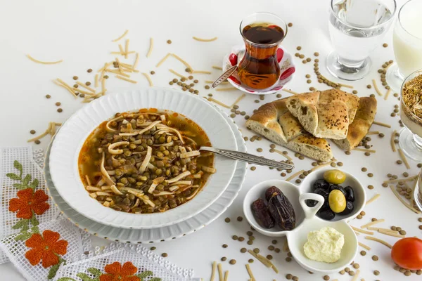 Traditional Turkish Ramadan-Iftar Meal is with green lentil soup,bread and tea on white. — Stock Image Traditional Turkish Ramadan Iftar Meal Green Lentil Soup Bread Tea Stock Picture