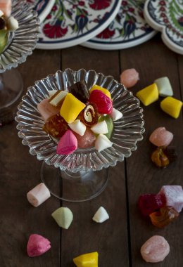 close-up shot of delicious turkish colorful caramel candies in glass cup