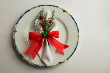 close-up shot of beautiful Christmas table setting with traditional Christmas decor