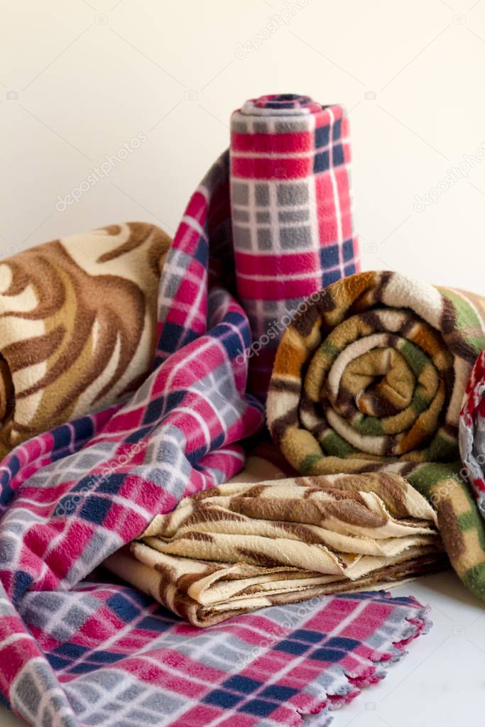 Rolled,woolen polar,fleece,colored  blankets.Close up taken.
