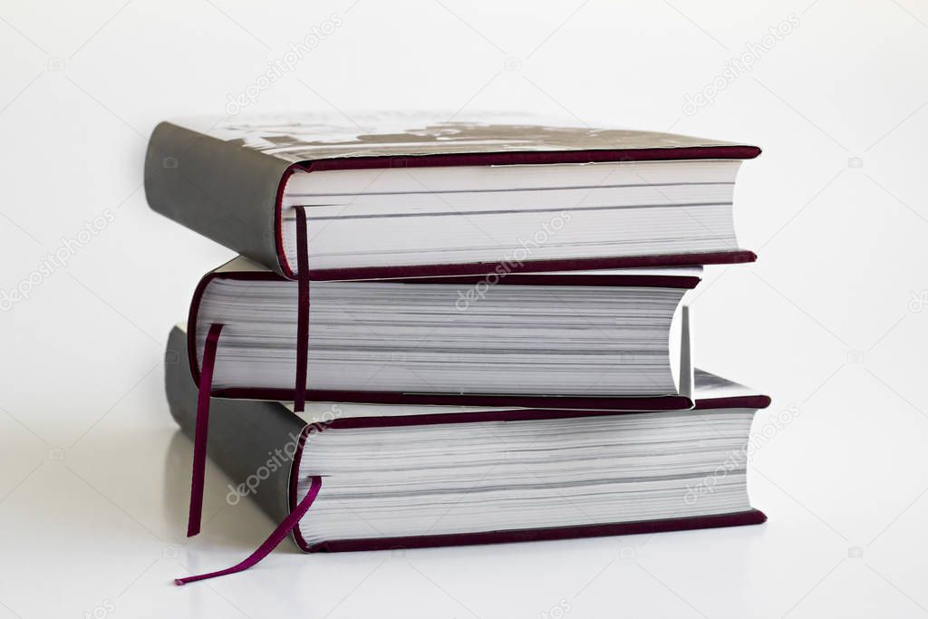 close-up shot of stack of books on white tabletop