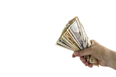 close-up shot of hand holding bunch of dollar bills isolated on white