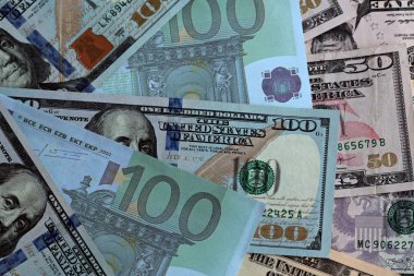 close-up shot of dollar bills with euros and liras for background