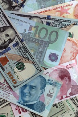 close-up shot of dollar bills with euros and liras for background