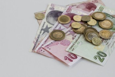 close-up shot of turkish liras and dollars on white background