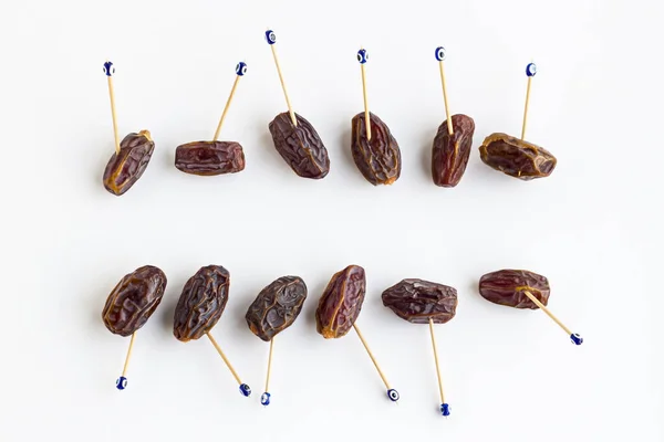 Traditional Dried Date Fruits Blue Bead Toothpicks White Copy Space — Stock Photo, Image