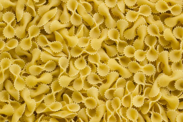 Traditionell Turkisk Dry Bow Tie Pasta Macaroni Bakgrund Ovanifrån — Stockfoto