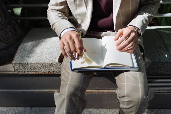 Man turns page on his Notebook — Stock Photo, Image