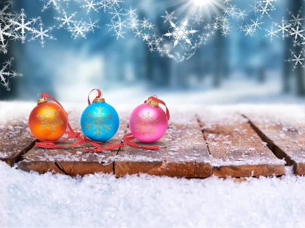 Festive Christmas Bauble decorations on a wooden table in a wint — Stock Photo, Image