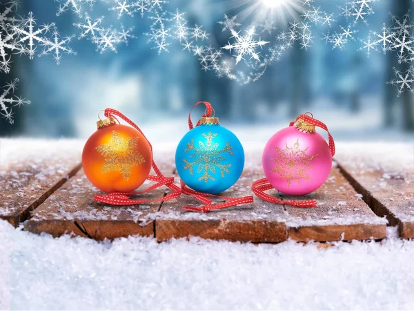 Festive Christmas Bauble decorations on a wooden table in a wint — Stock Photo, Image