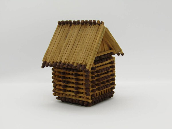 A toy house made of matches without glue.