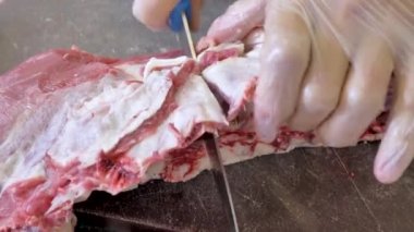 Cutting of sheep meat. Make a sacrifice of a sheep on Kurban bayram. Butcher cut meat