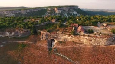 Top view of the valley with cliffs and forest. cave city