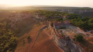 Top view of the valley with cliffs and forest. cave city