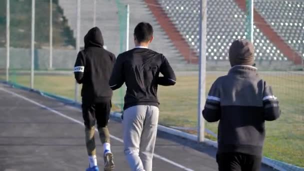 Warm - up of young athletes before training. morning fitness. jogging — Stock Video