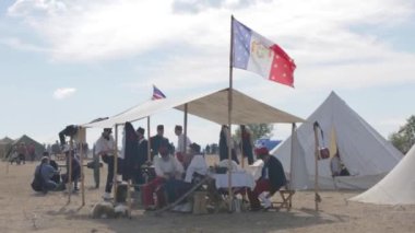 The flag of the French Empire. Military camp. Crimean War. Re-enacting of scenes