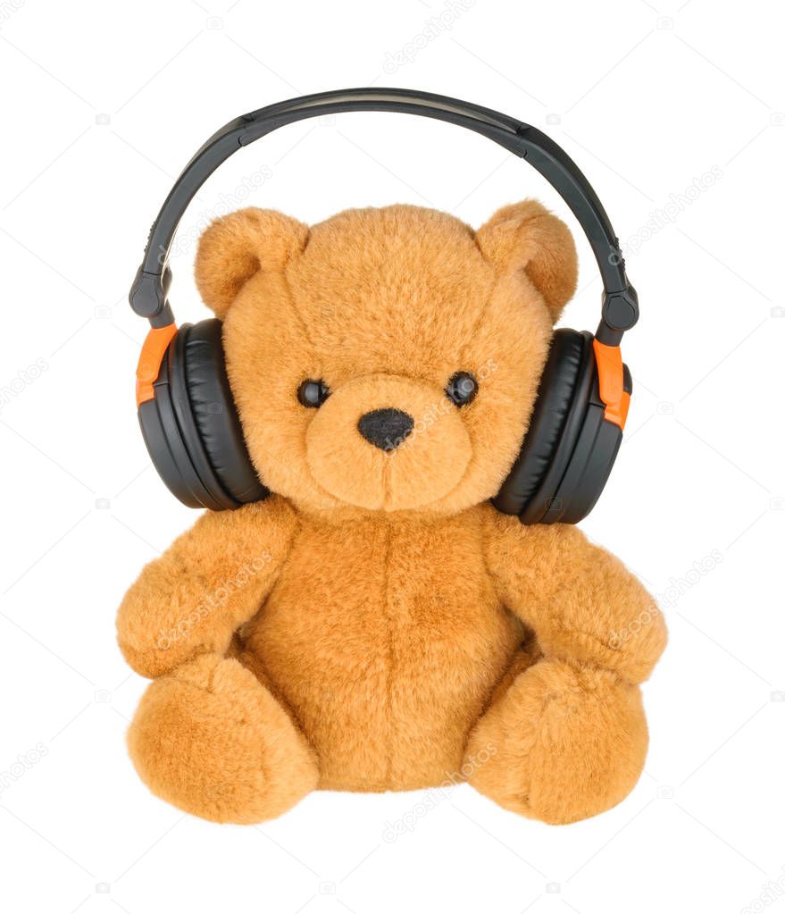 Teddy bear with headphones isolated on white