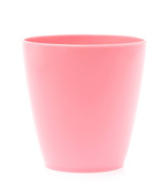 Empty pink plastic glass isolated on white background