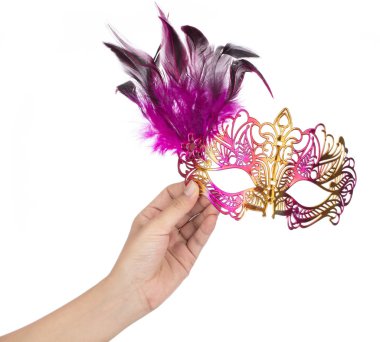 Hand holding beautiful of carnival mask with feather isolated on